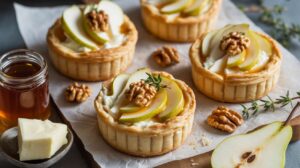Tartelettes chèvre, miel, poire et noix : recette gourmande